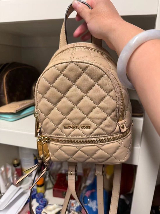 Michael Kors Handbags - Michael Kors Beige Quilted Mini Backpack